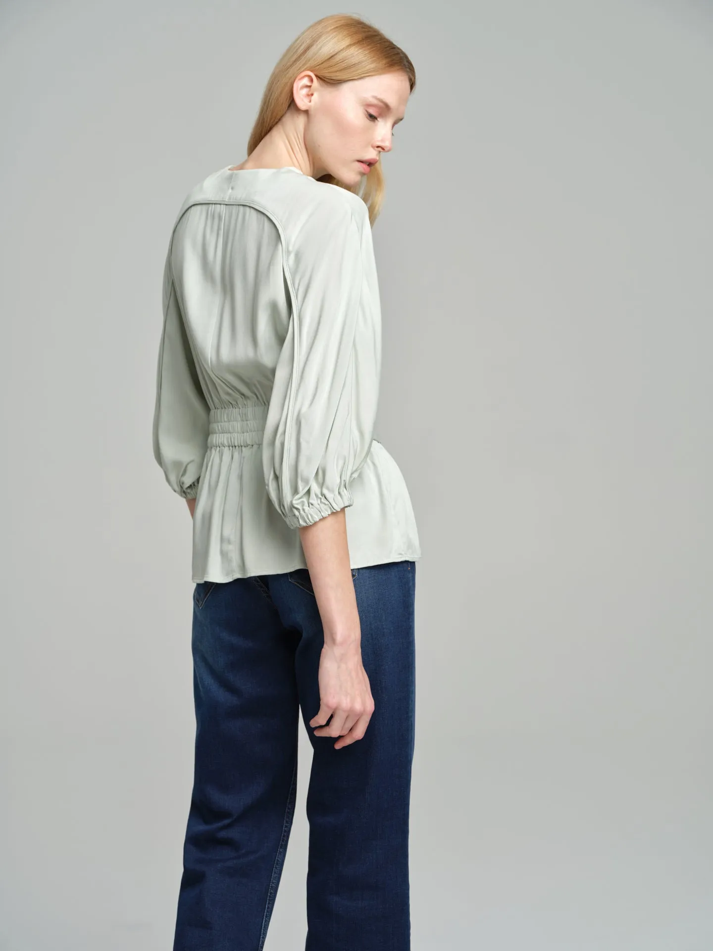 Fancy belted blouse with tear drop neckline