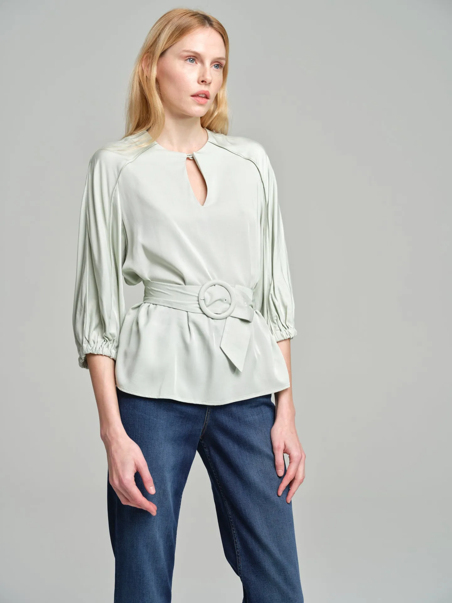 Fancy belted blouse with tear drop neckline