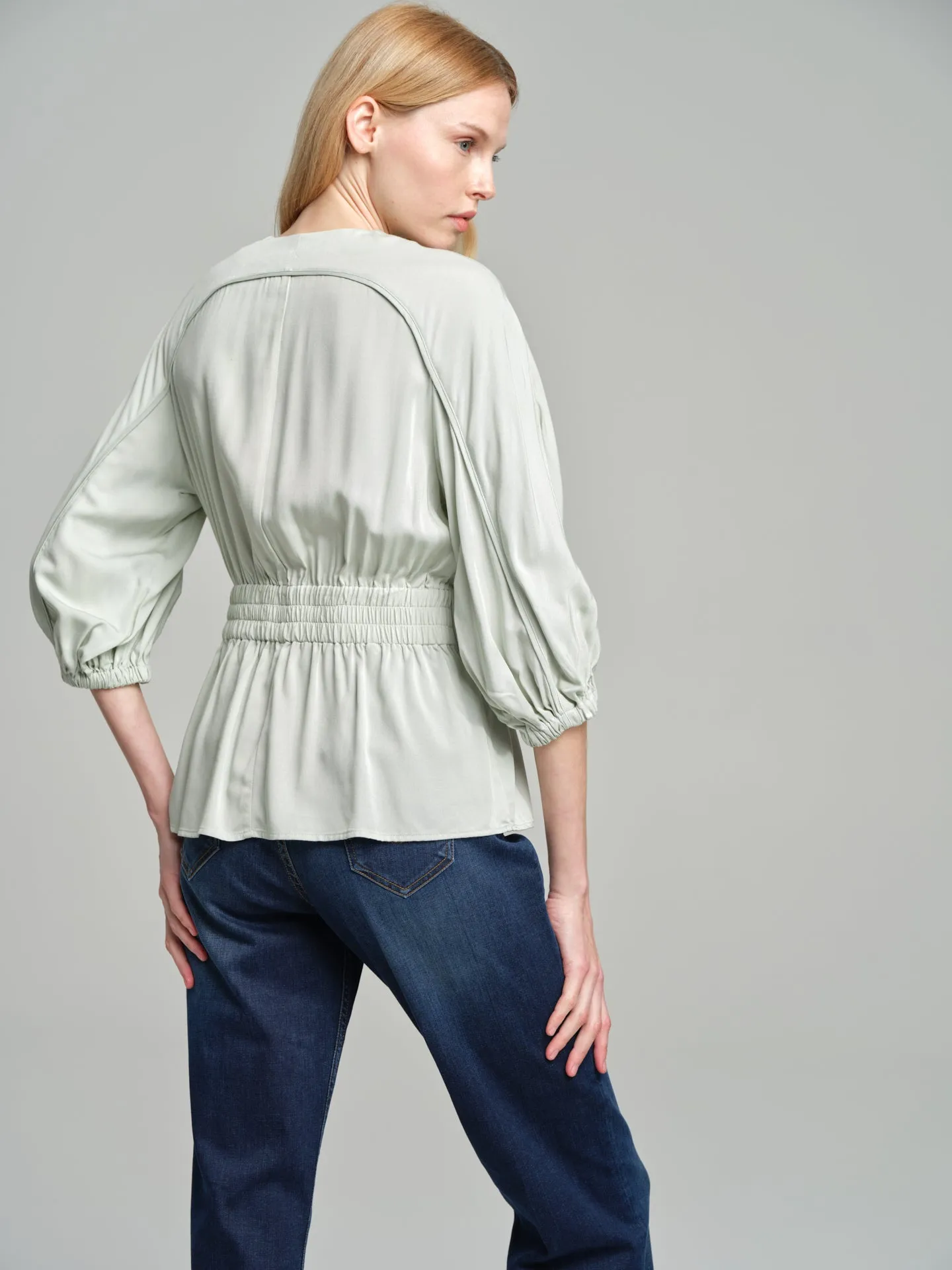 Fancy belted blouse with tear drop neckline