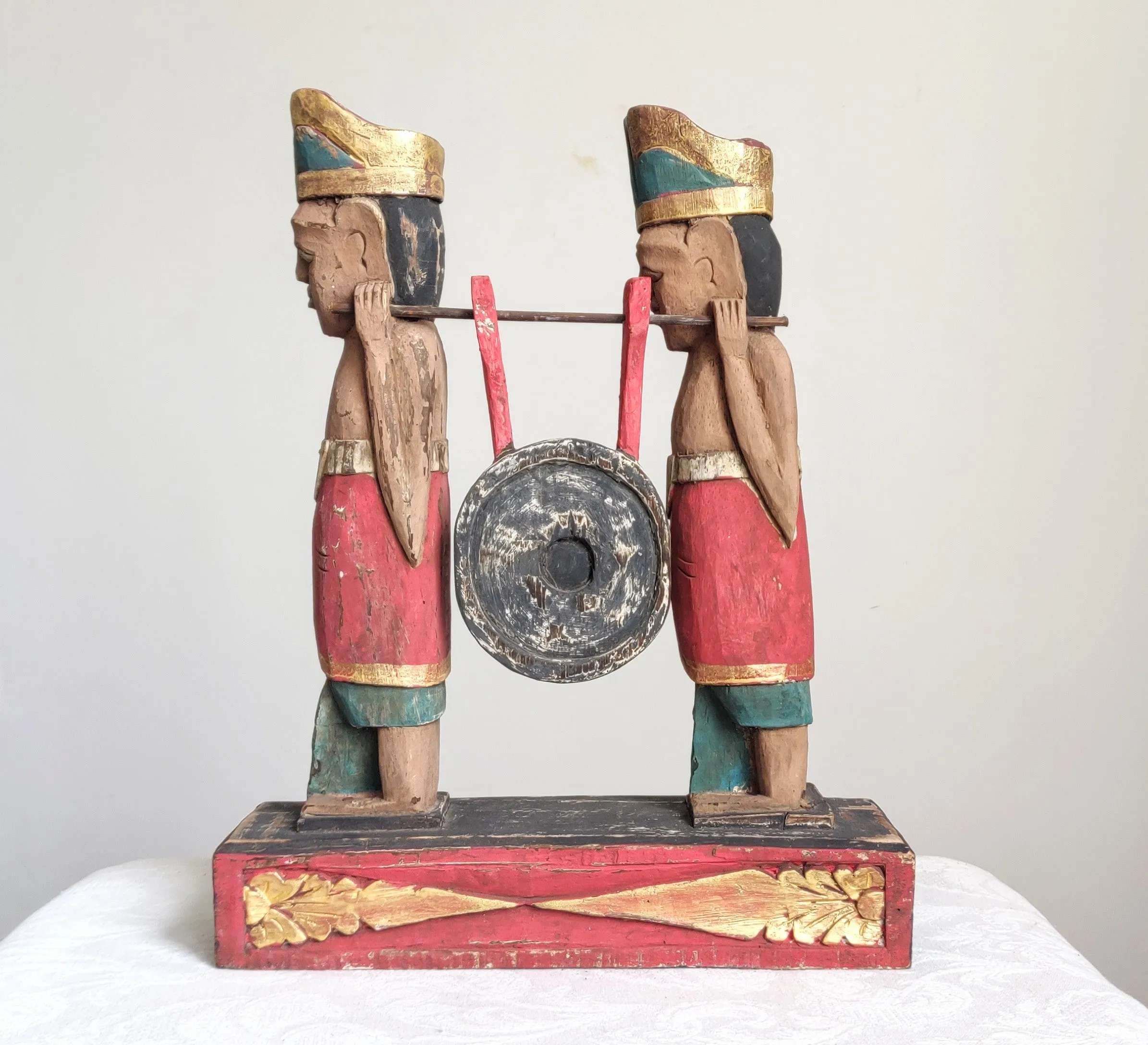 Home Decor. Tabletop Sculpture.
Hand Carved and Painted Pair of Solid Wooden Figures on a Floral Pedestal - Melasti, a Hindu Ceremony.